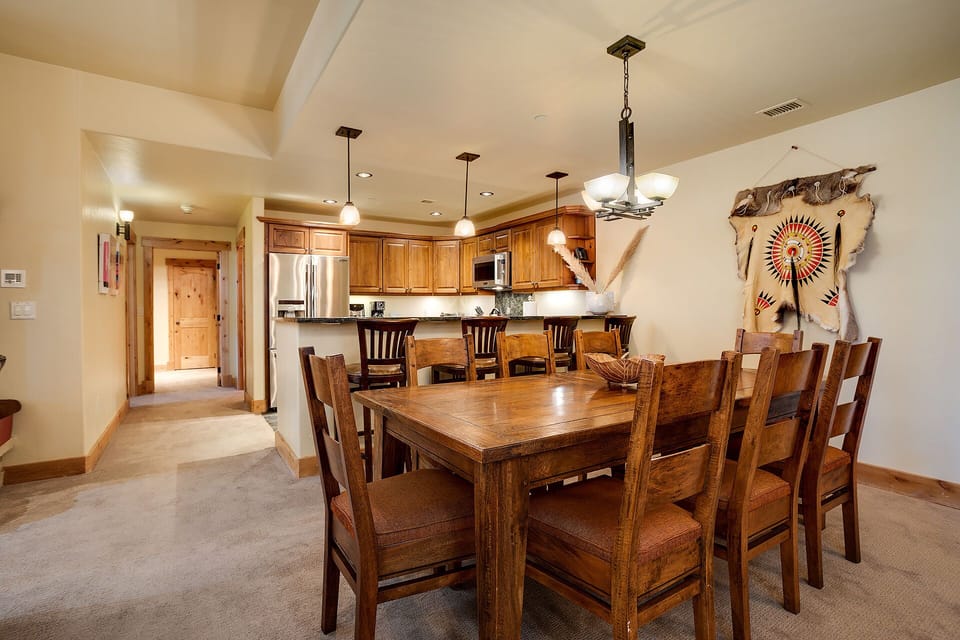 Gather around this beautiful wooden dining table where you'll create lasting memories with family and friends over delicious meals.