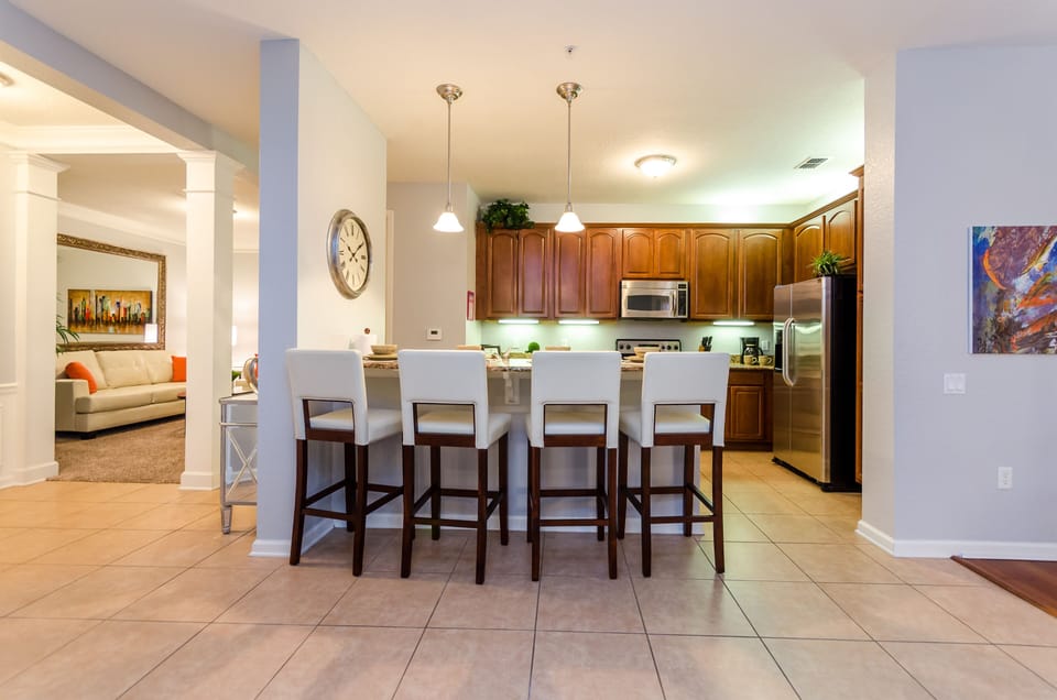 The stylish kitchen table top and high chairs – where every meal becomes a delightful affair, surrounded by elegance and comfort. Embrace the joy of shared moments and delectable cuisine.