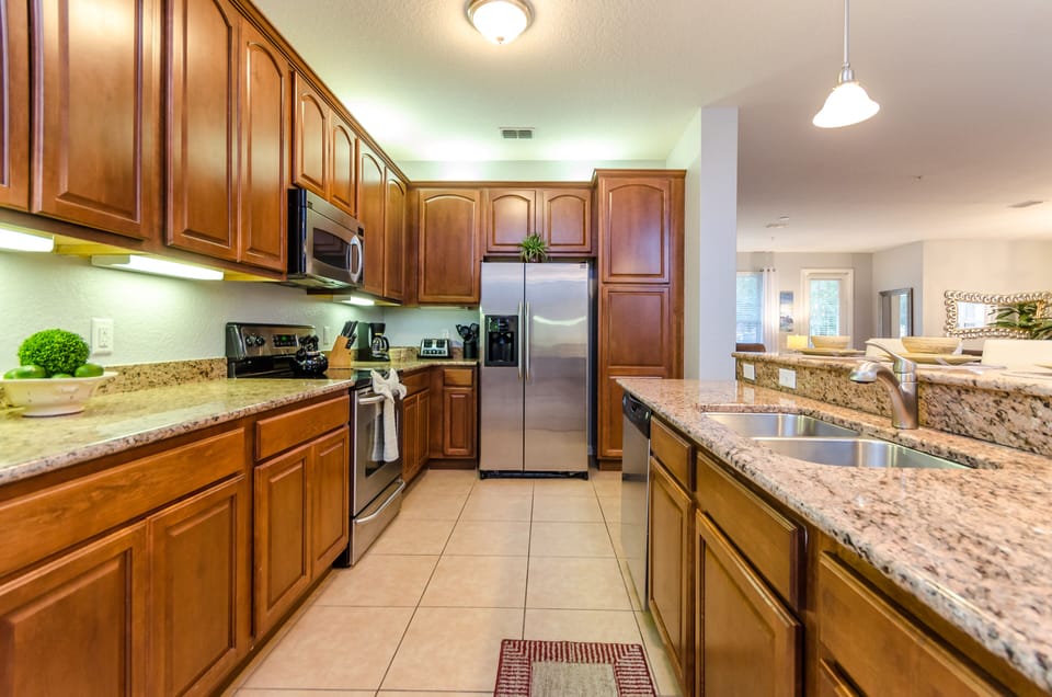 The Kitchen- where the space flows seamlessly, inviting you to cook your favorite dishes amidst elegance and comfort.