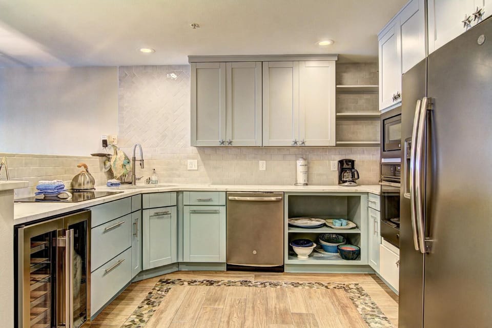 Your fully-equipped kitchen features modern appliances and ample counter space for preparing memorable meals during your stay.