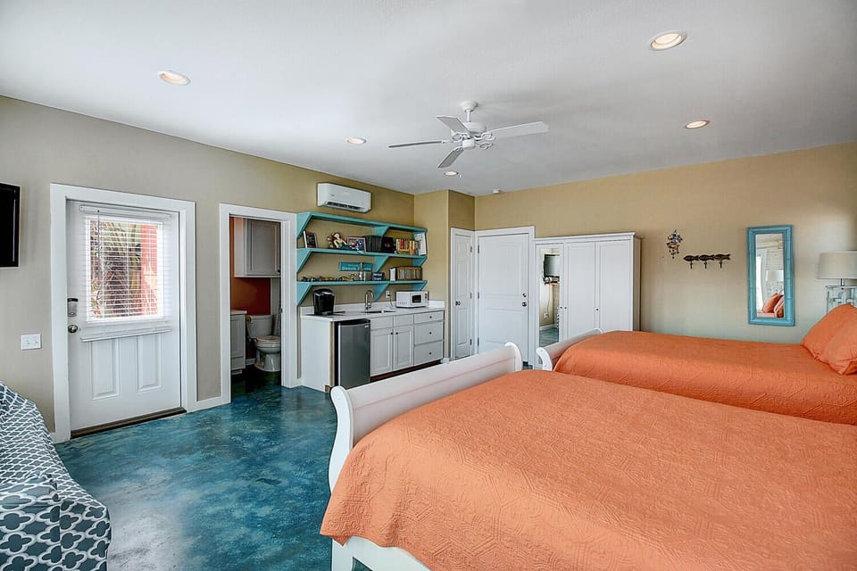 bedroom #1 with kitchenette - First-floor accommodations featuring a full bath, kitchenette, and patio access.