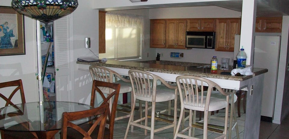 Dining Table, Chairs and Dining Bar looking into Kitchen