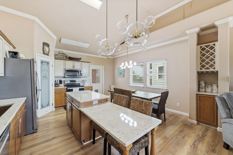 The spacious kitchen overlooks the dining and living areas, making it easy to cook, dine, and spend time together.