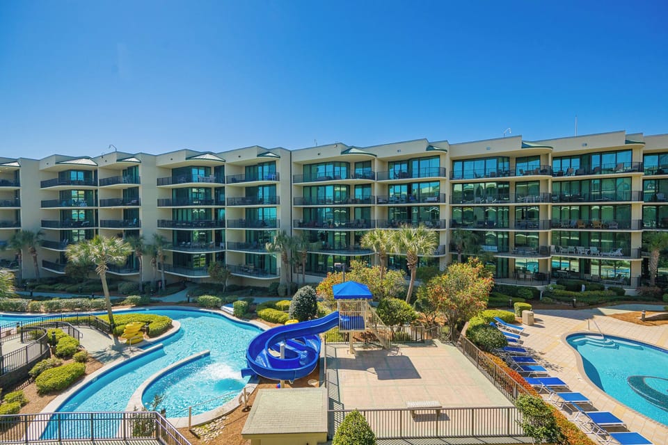 Swirling water invites you to relax poolside where vibrant slides spark joyful moments for the whole family