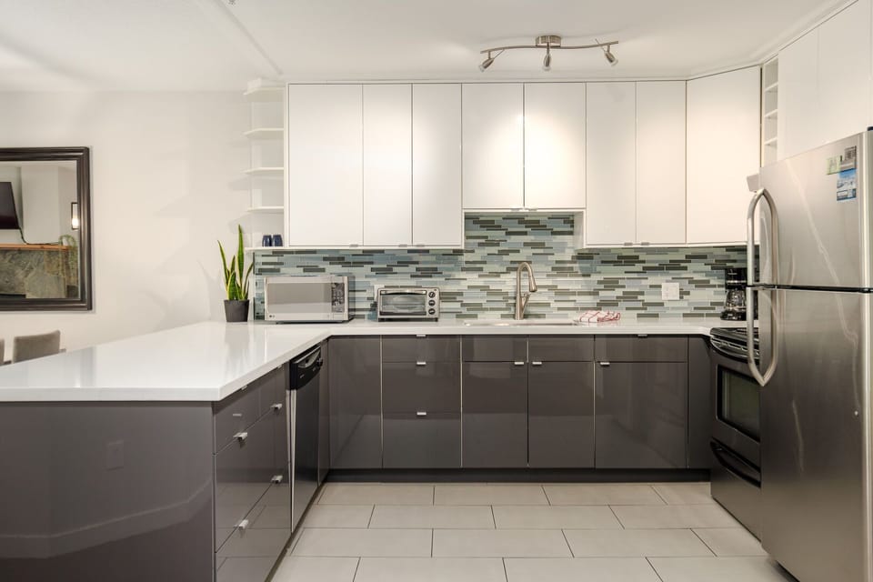 Cook with ease in the spacious kitchen featuring stainless steel appliances and all the essentials.