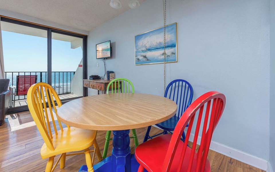 Gather around the cheerful table and create lasting memories as you enjoy family game night with a view of the coast