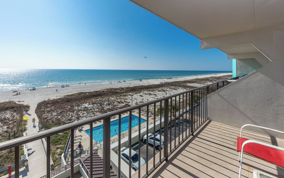 Breathe in the coastal breeze as you relax on your balcony, soaking in views of the shimmering shoreline