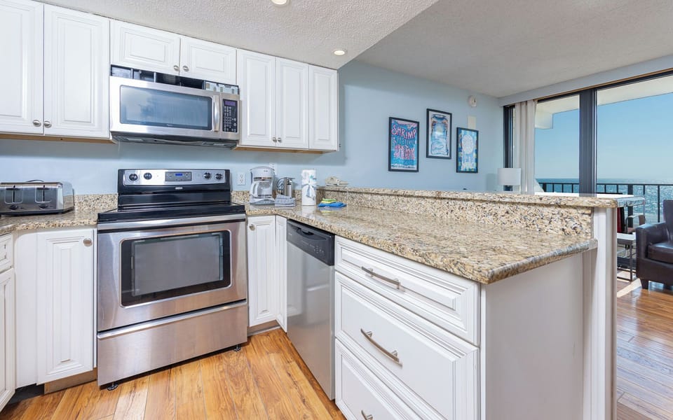 Craft delightful meals as you enjoy the vibrant decor and coastal vibes enveloping your inviting kitchen space