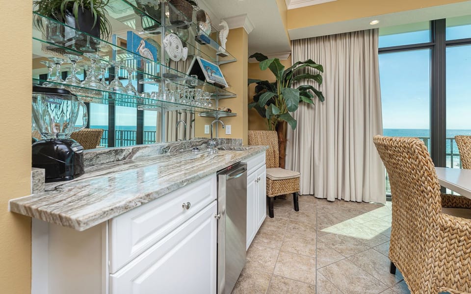 Refreshment bar where you sip chilled drinks while hearing distant surf beyond the balcony door