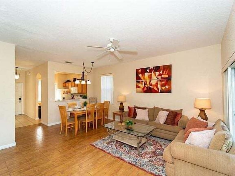Living area showing front door and kitchen