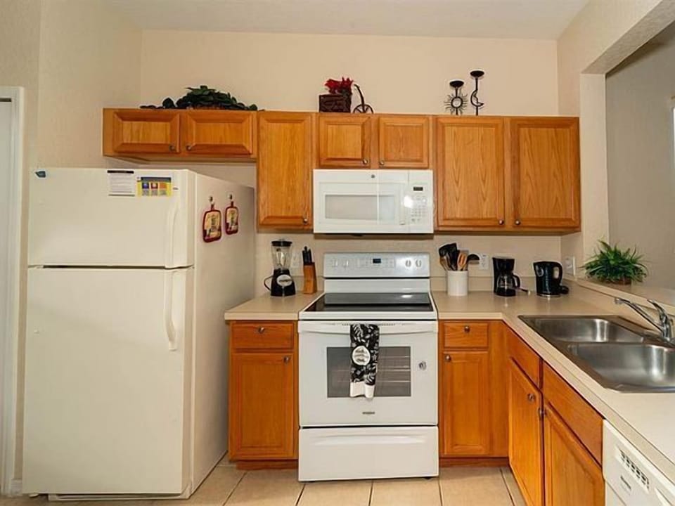 Fully equipped kitchen showing refrigerator