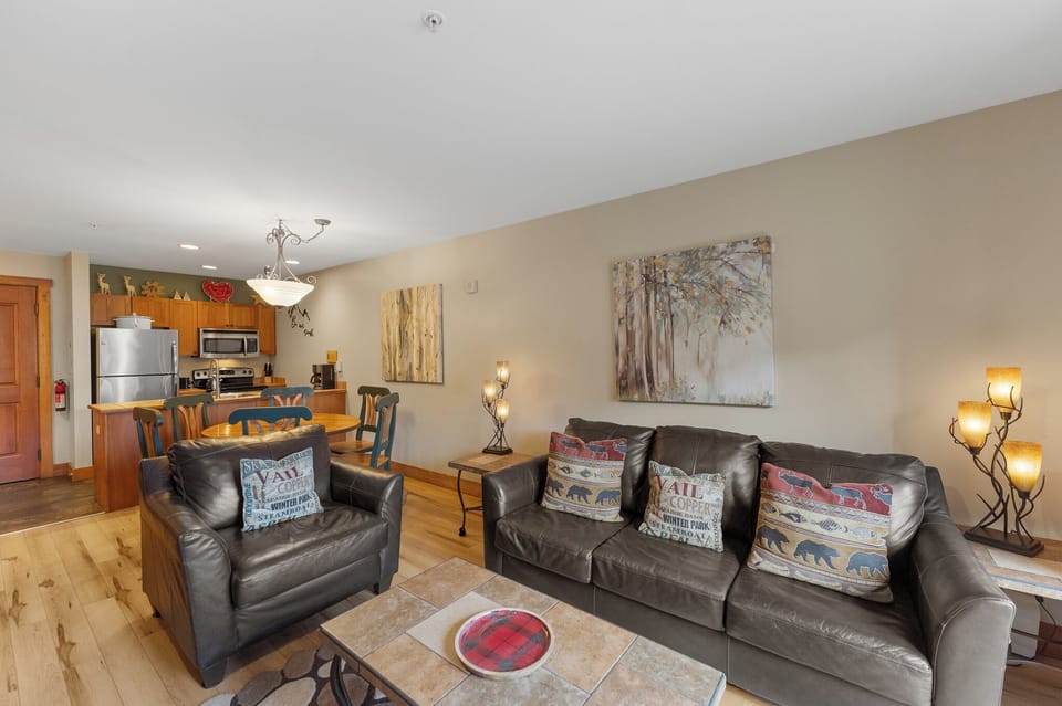 Settle into your cozy living space with plush leather seating and rustic charm, perfect for unwinding after mountain adventures.