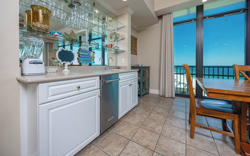 Mix up your favorite drinks at the wet bar, while soaking in the stunning coastal views from your balcony