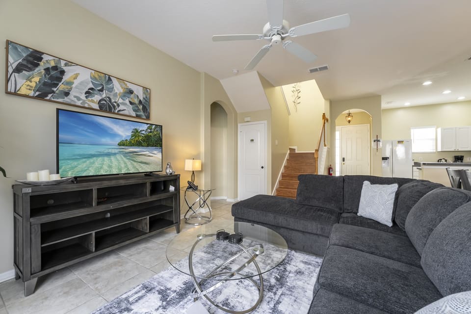 Living room showing sofa with chaise, TV