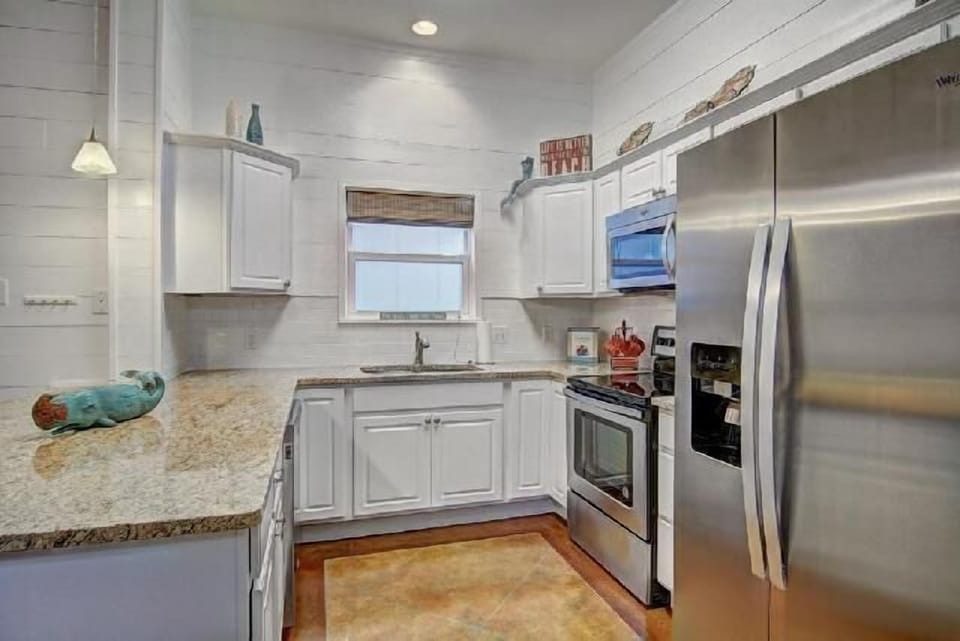 Your fully equipped kitchen features granite countertops, stainless steel appliances, and everything you need to create memorable meals during your stay.