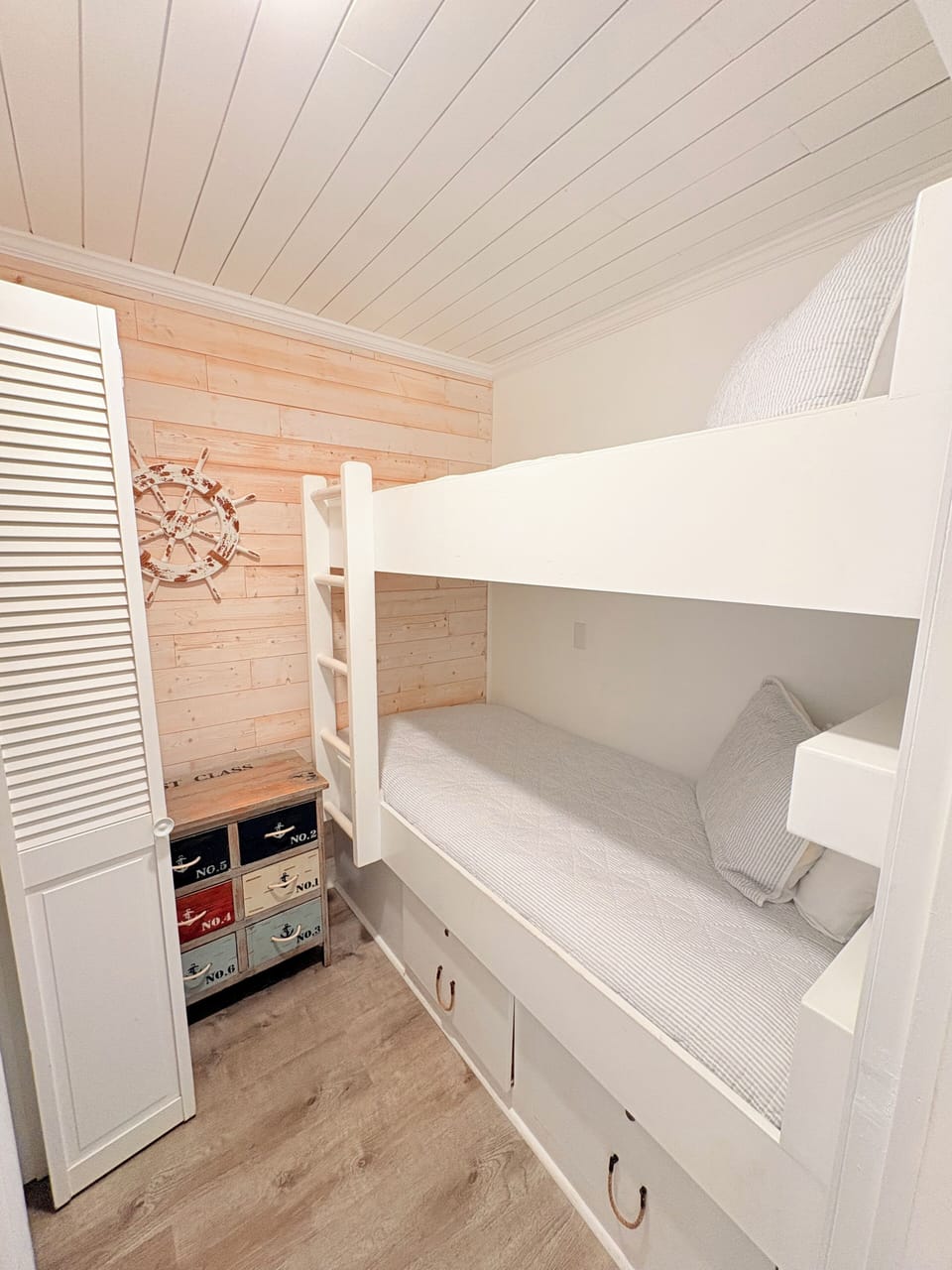 Climb to your private loft retreat with charming nautical touches and built-in storage for all your vacation essentials.