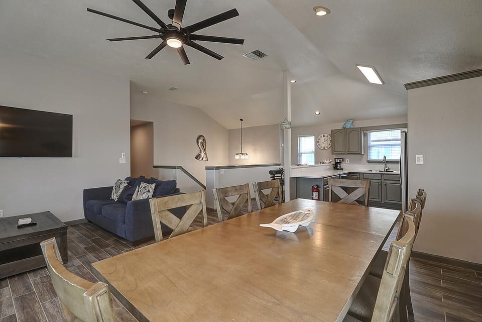 Gather around your spacious dining table with room for eight, while the open-concept design lets you stay connected to loved ones relaxing in the living room.