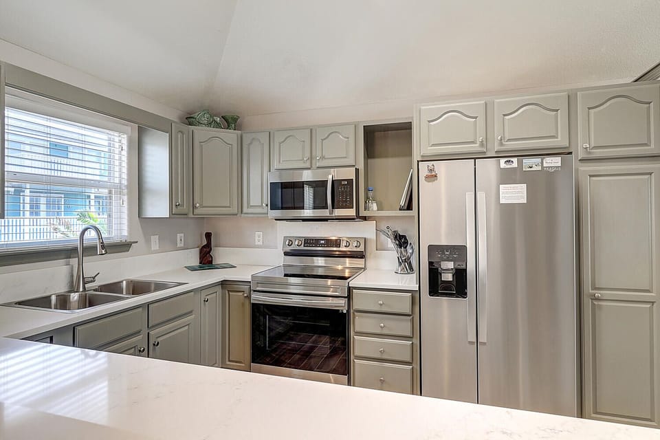 Your fully equipped kitchen features stainless steel appliances and granite countertops, perfect for preparing meals during your stay.