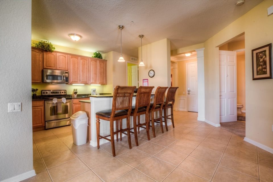 The rustic allure of wooden accents adds a touch of natural beauty to the heart of our home, creating a cozy and inviting atmosphere for culinary adventures and cherished gatherings.