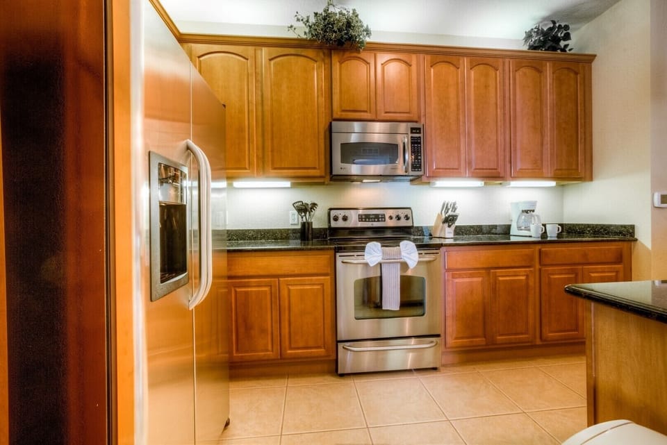 Welcome to the elegant kitchen area of our Orlando, Florida apartment, fully equipped to inspire culinary excellence. Revel in ample storage space, ensuring organized and clutter-free counters for seamless meal preparation.