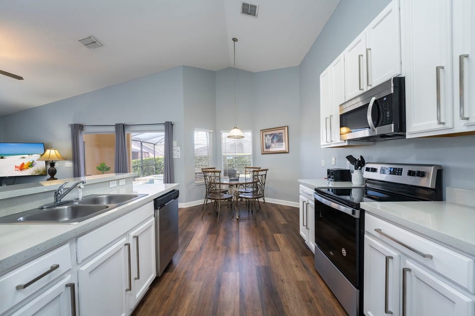 Kitchen also showing breakfast nook table seating 4