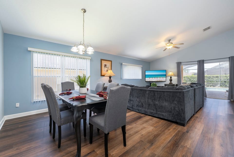 Dining and living rooms showing seating.