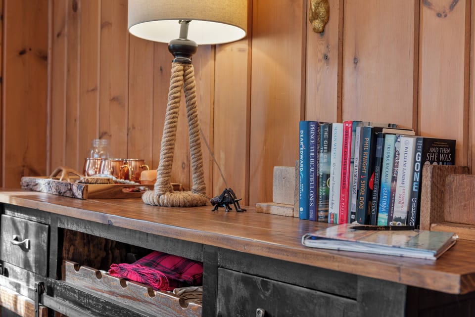 Cozy corner w/ books ready for a quiet moment indoors.