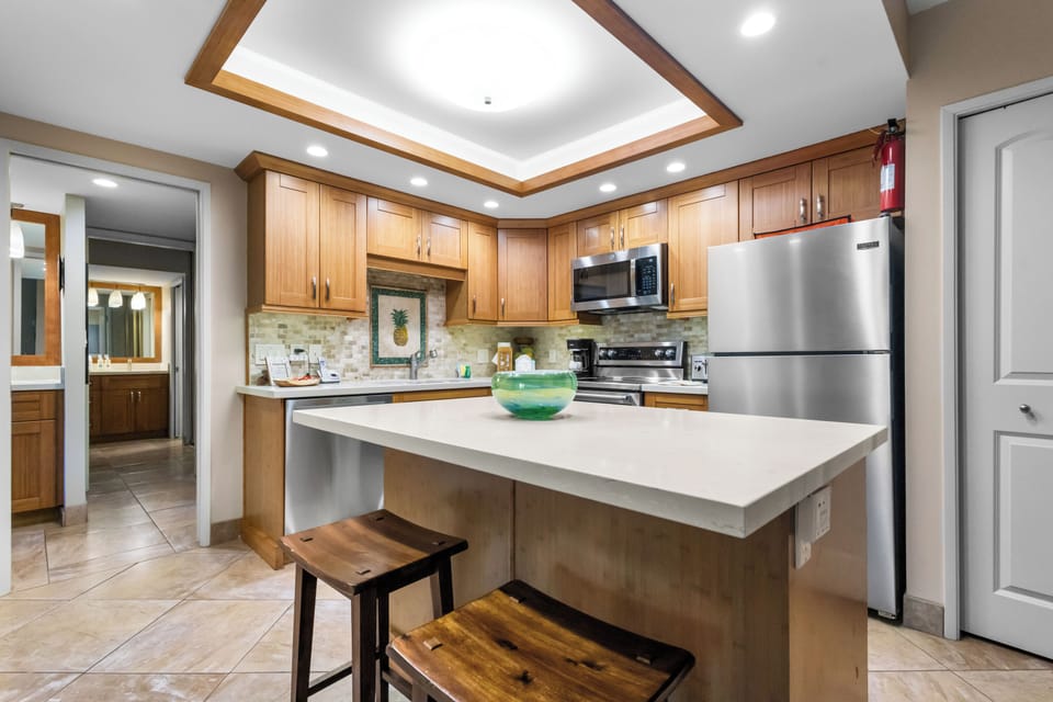 Cook memorable meals in your fully equipped kitchen featuring modern appliances, granite countertops, and a convenient breakfast bar perfect for morning coffee.