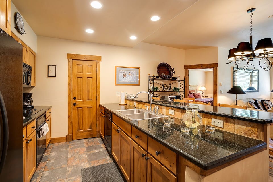 Your gourmet kitchen features granite countertops, warm wood cabinetry, and everything needed to prepare memorable meals during your stay.