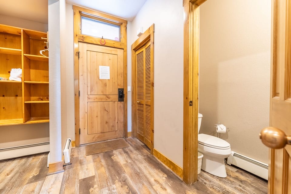 Your private retreat features warm wood accents, organized storage, and a convenient powder room—perfectly designed for mountain comfort.
