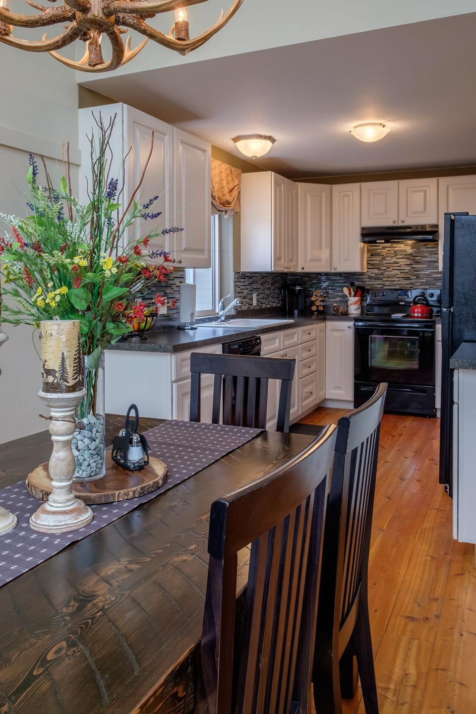 The quaint kitchen opens up to the dining room.