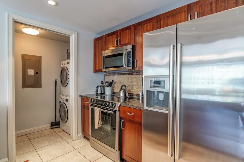 Fully equipped kitchen with stainless steel appliances and built-in convenience