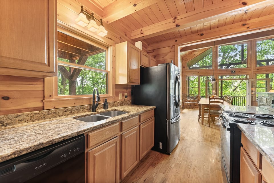 Fully equipped kitchen with modern conveniences and cabin charm.