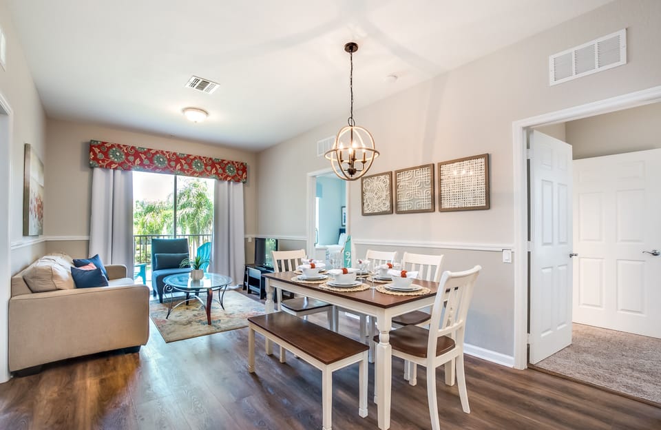 The dining and living area invites you to gather and unwind in comfort and style. A space where meals transform into cherished memories and relaxation becomes an art, promising moments of togetherness and joy.