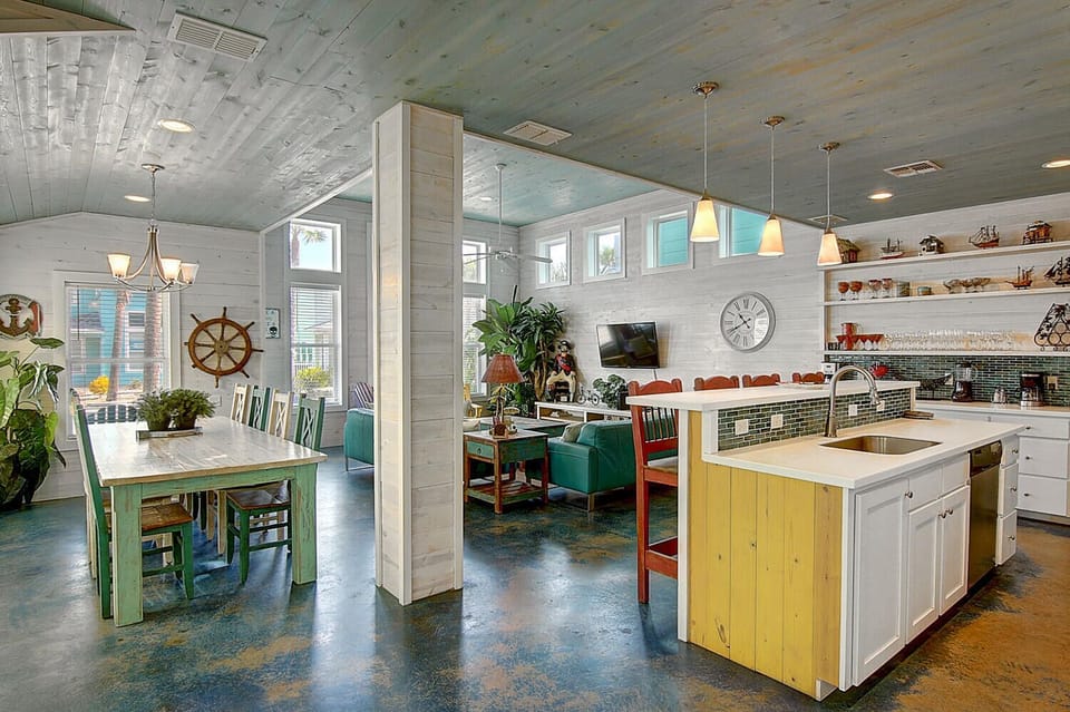 Your spacious kitchen welcomes you with colorful island seating, rustic charm, and everything needed for memorable meals together.