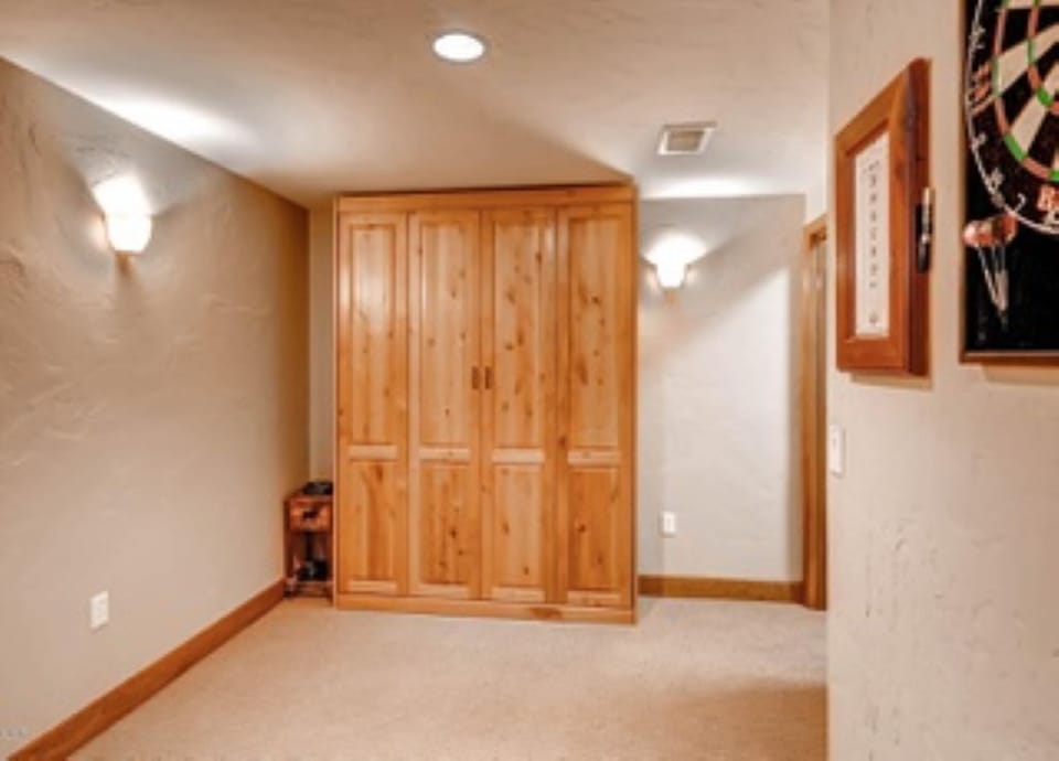 Queen murphy bed in game room