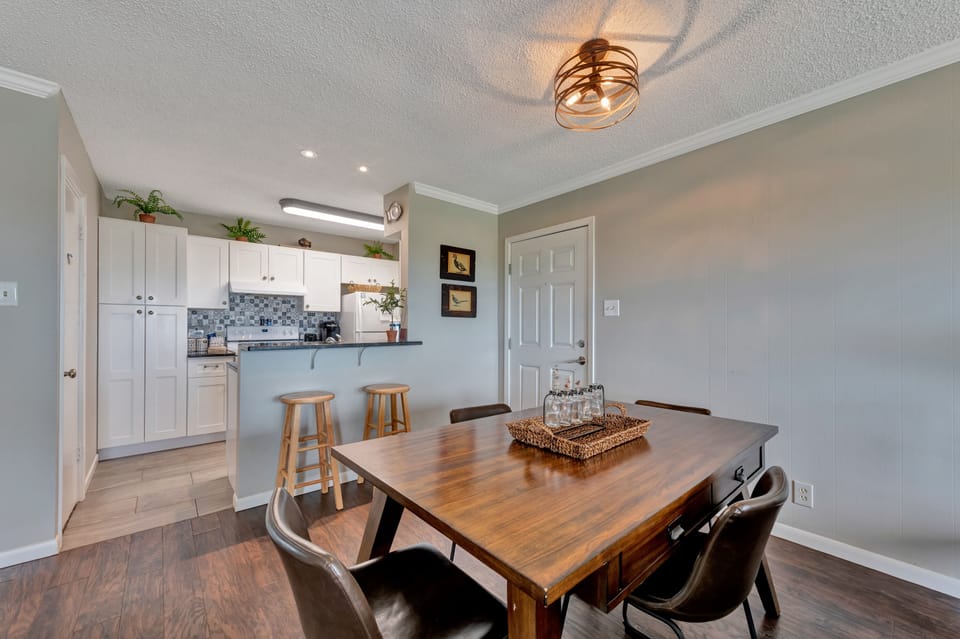 Gather around the warm wood dining table where memories are made over home-cooked meals from your fully equipped kitchen.