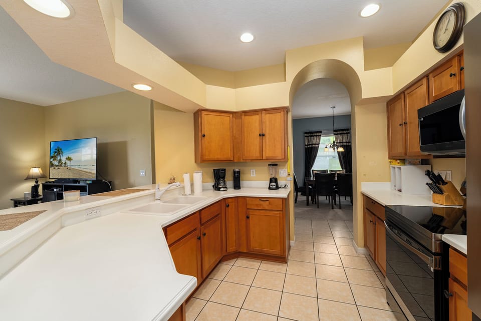 Spacious fully equipped kitchen with access to dining area