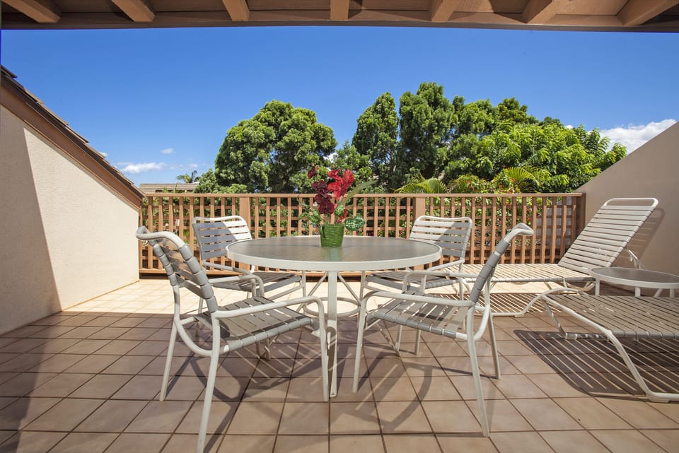 Your private terrace opens to lush greenery and sunny skies—perfect for morning coffee, al fresco dining, or simply soaking up the peaceful surroundings from your lounge chair.