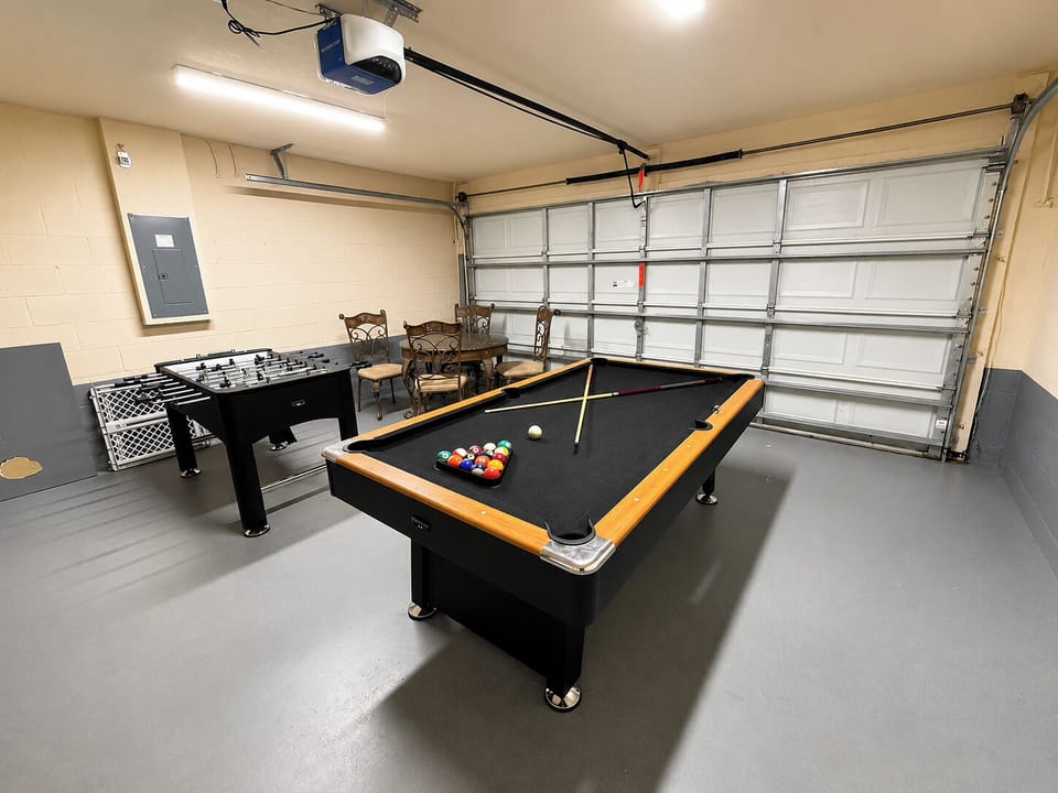 Game room showing pool table and foosball.