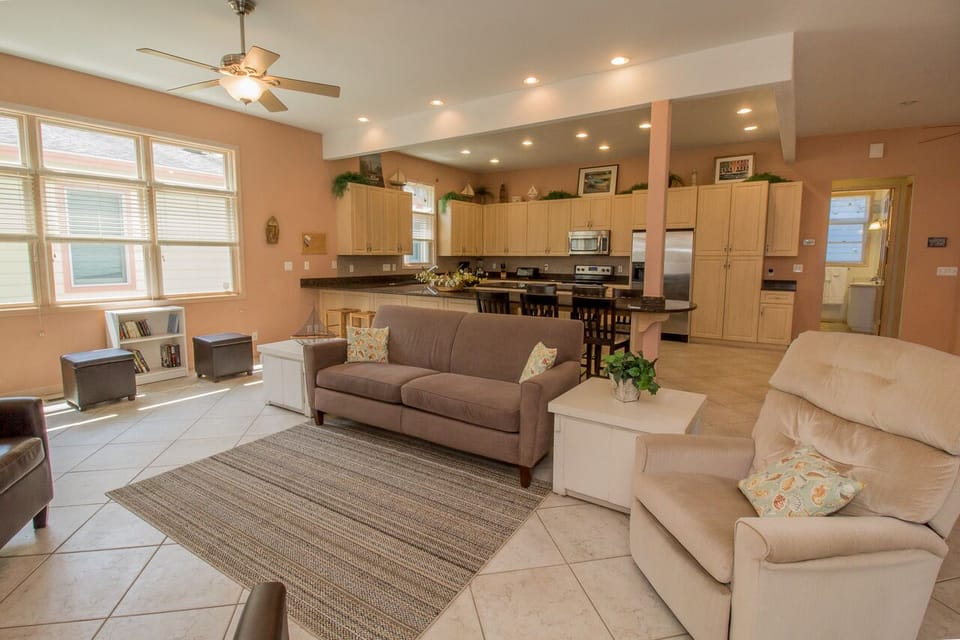 Main Level | Living Room - Enter into the open living, dining, and kitchen area.  This is great for gathering the entire family all into one room.