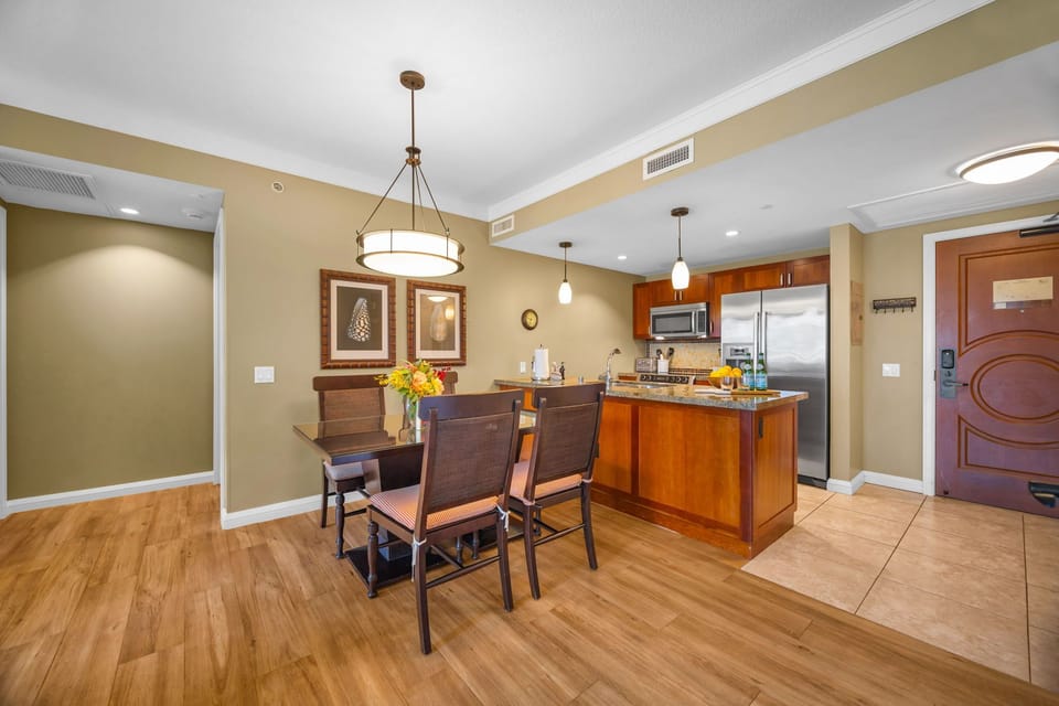 Dine indoors with views of the resort gardens through wide lanai doors that invite the breeze in.