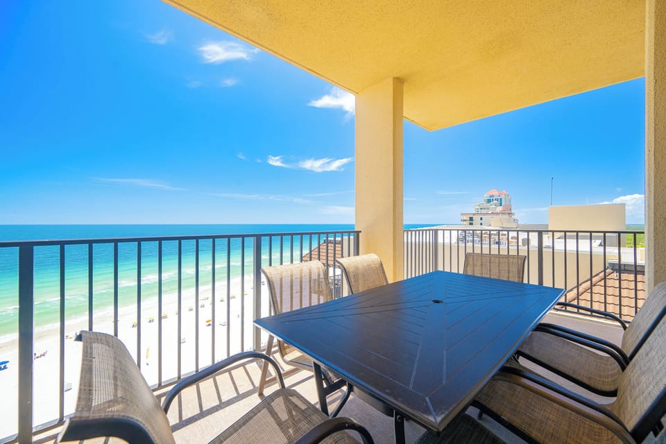 Your balcony invites relaxing meals with warm gulf breezes and endless blue coast views
