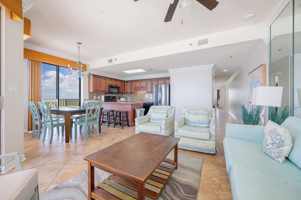 Soft light filters through the large sliding door brightening the living room as you settle into cozy seats