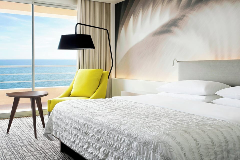 Premium Room, 1 King Bed, Balcony, Partial Sea View | Premium bedding, pillowtop beds, minibar, in-room safe