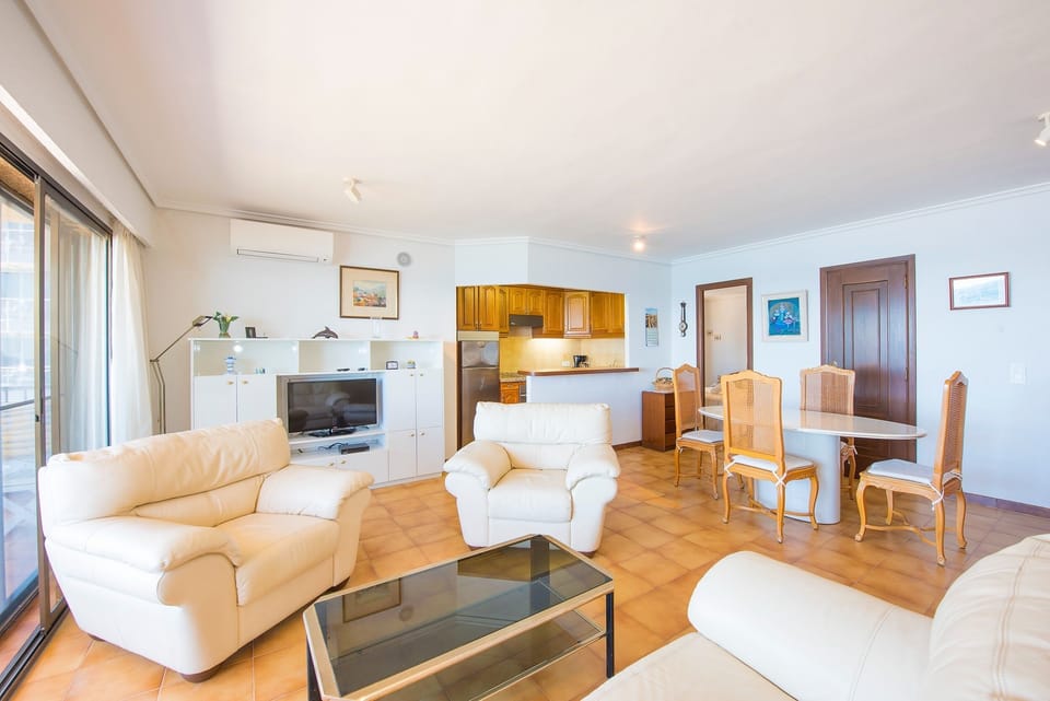 This lovely frontline beach apartment in Calpe, Costa Blanca sounds absolutely wonderful! With all the necessary comforts and a privileged location, you will surely enjoy an unforgettable vacation.The spacious living-dining room with SAT/TDT TV, air conditioning and access to the spacious terrace will allow you to relax and enjoy the impressive sea views. The open kitchen equipped with a ceramic hob will give you the comfort of preparing your own meals. The bedroom with a double bed and the independent bathroom with bathtub will ensure your rest and relaxation.The beautiful outdoor terrace is the perfect place to enjoy the surroundings and relax in the fresh air. In addition, having a garage space for one vehicle is a great advantage.The location of this apartment is really convenient, as it is close to all the necessary services, such as restaurants and supermarkets. And of course, being just a few steps from the sandy beach will allow you to enjoy the sea and sunbathe without having to travel far. In addition, the center of Calpe is within walking distance, giving you the opportunity to explore the city and enjoy its charm.It is important to note that the apartment offers free WiFi and pets are not allowed. In case the apartment is occupied by 3 people, a free extra bed will be provided in the living room for more comfort.Don't hesitate to book this charming apartment in Calpe to enjoy an unforgettable holiday on the beautiful Costa Blanca. We assure you that it will be an incredible experience!