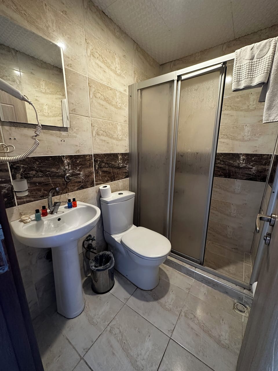Shower, free toiletries, hair dryer, slippers