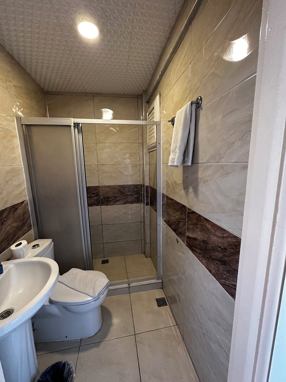 Shower, free toiletries, hair dryer, slippers
