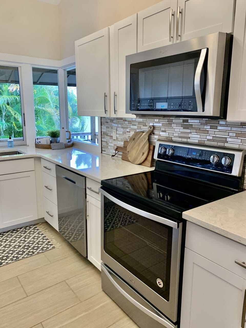 Enjoy cooking and over looking a tropical paradise with a pool and waterfront.