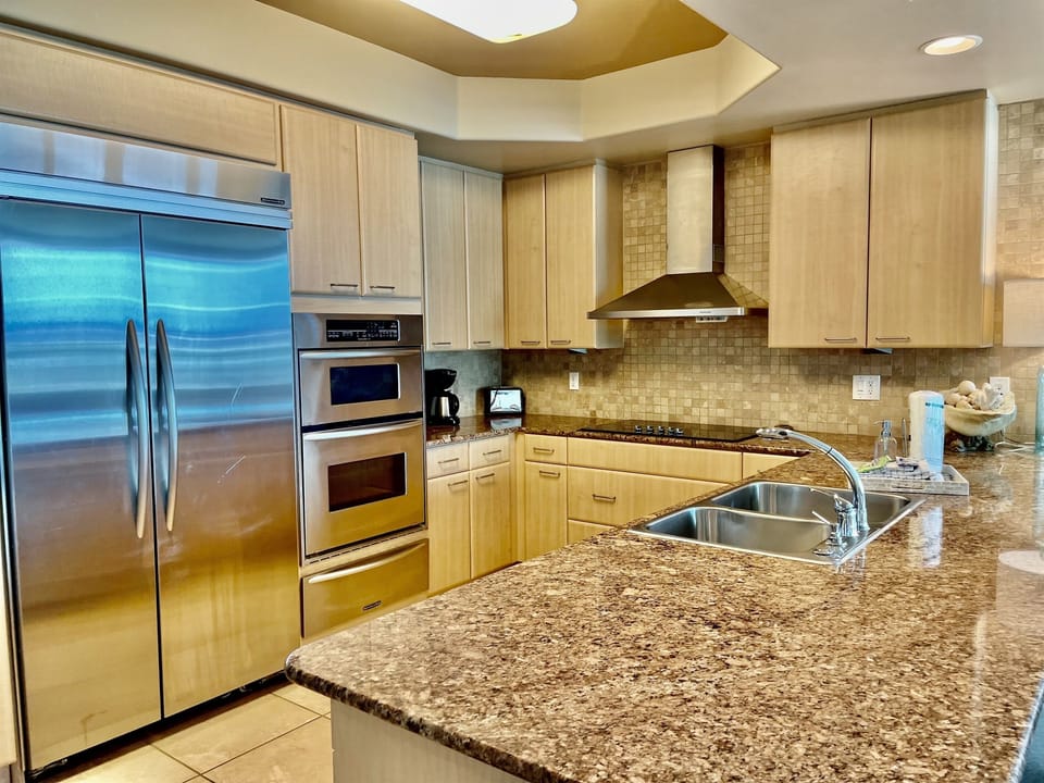 With granite countertops, upgraded stainless appliances, a Keurig coffee maker and a standard coffee maker, this is a fully-stocked kitchen.
